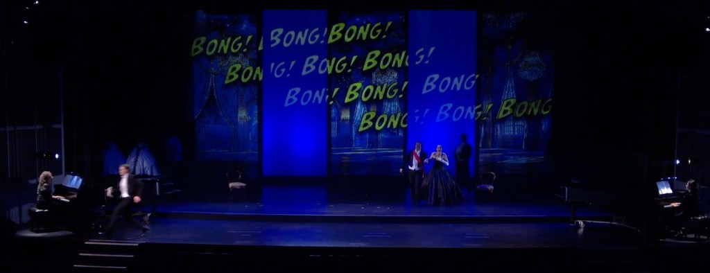 The stroke of midnight scene with a backdrop showing the loud chime of the clock.